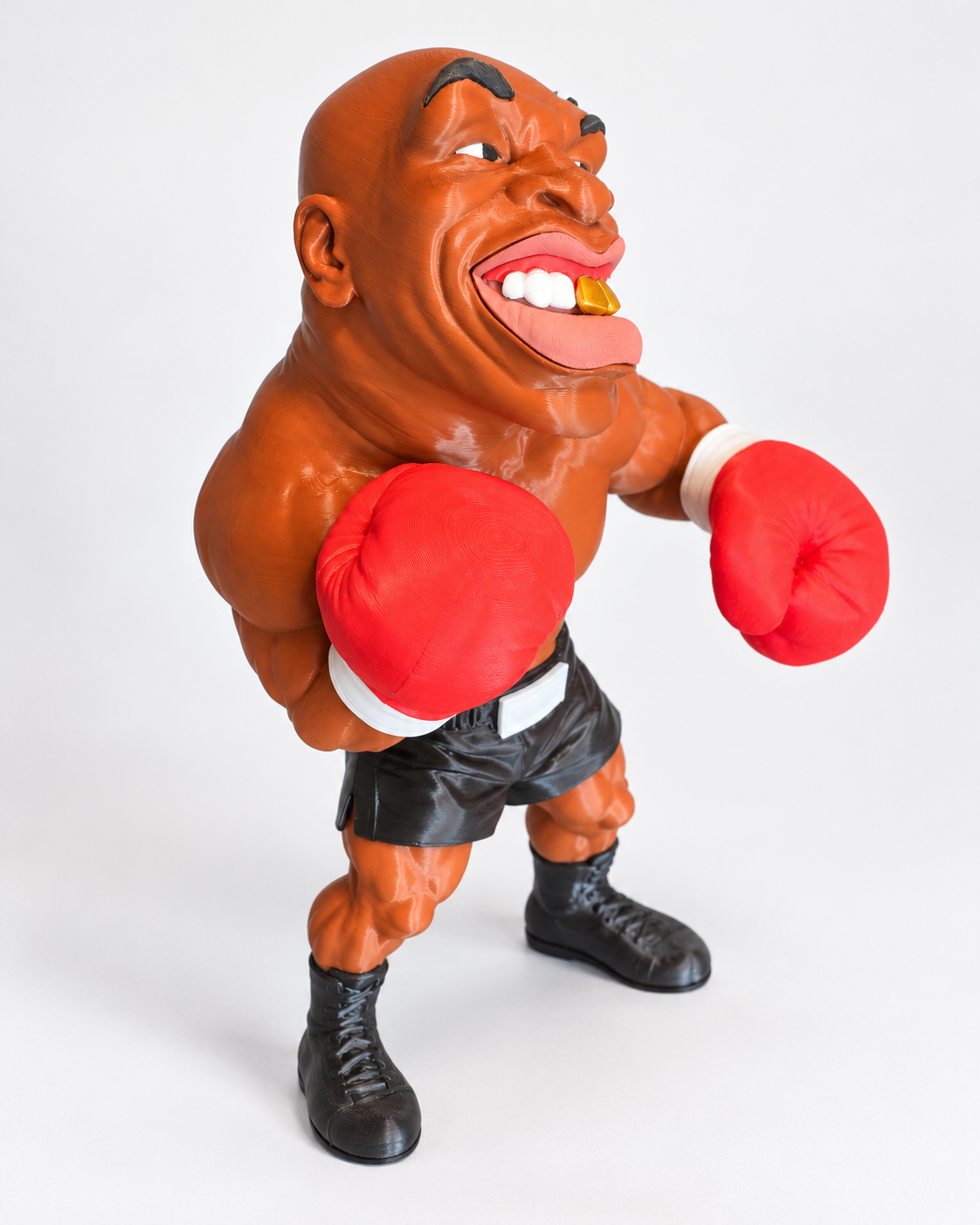 Freestanding 3D printed boxer caricature figure, side angled view