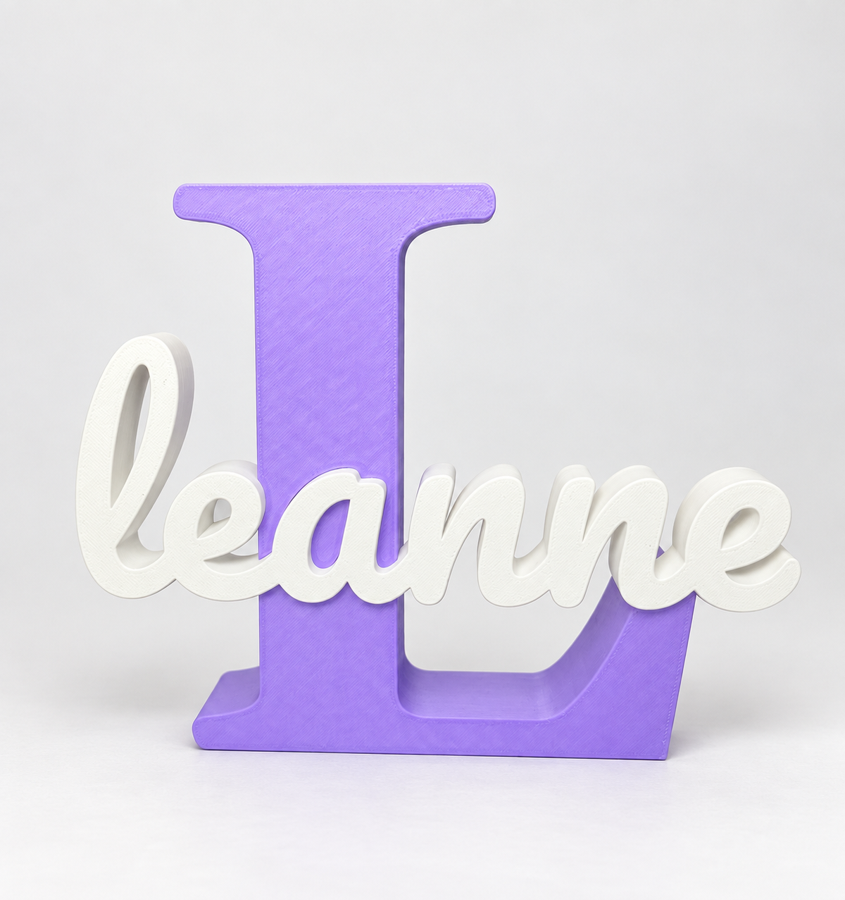 Personalised 3D printed name and initial sign with purple L and white Leanne lettering