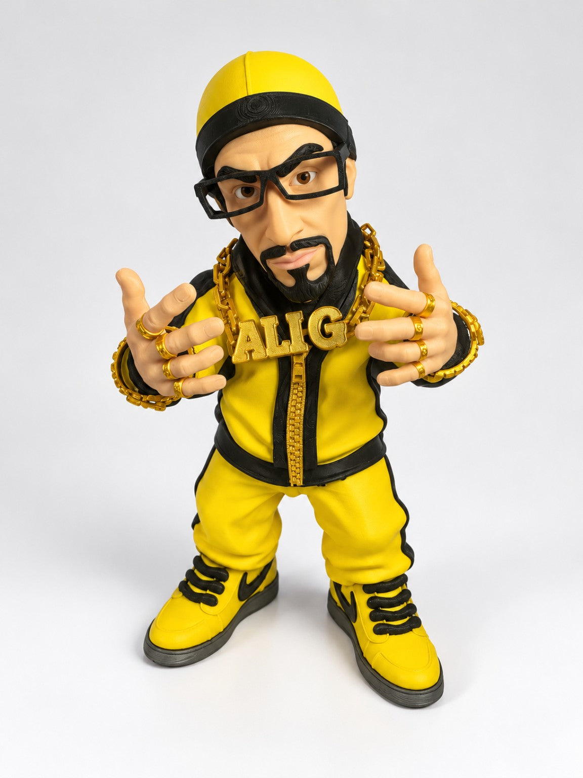 Ali G inspired 35cm figure wearing yellow black outfit cap glasses and gold chain