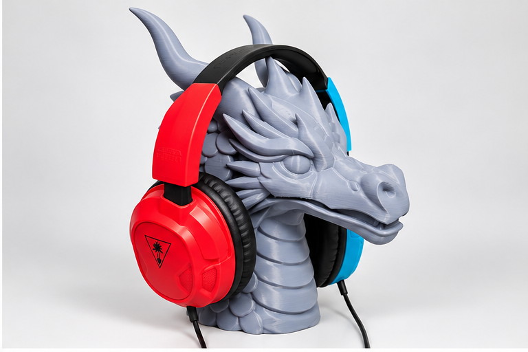 3D printed dragon headphone stand holding a gaming headset, angled view