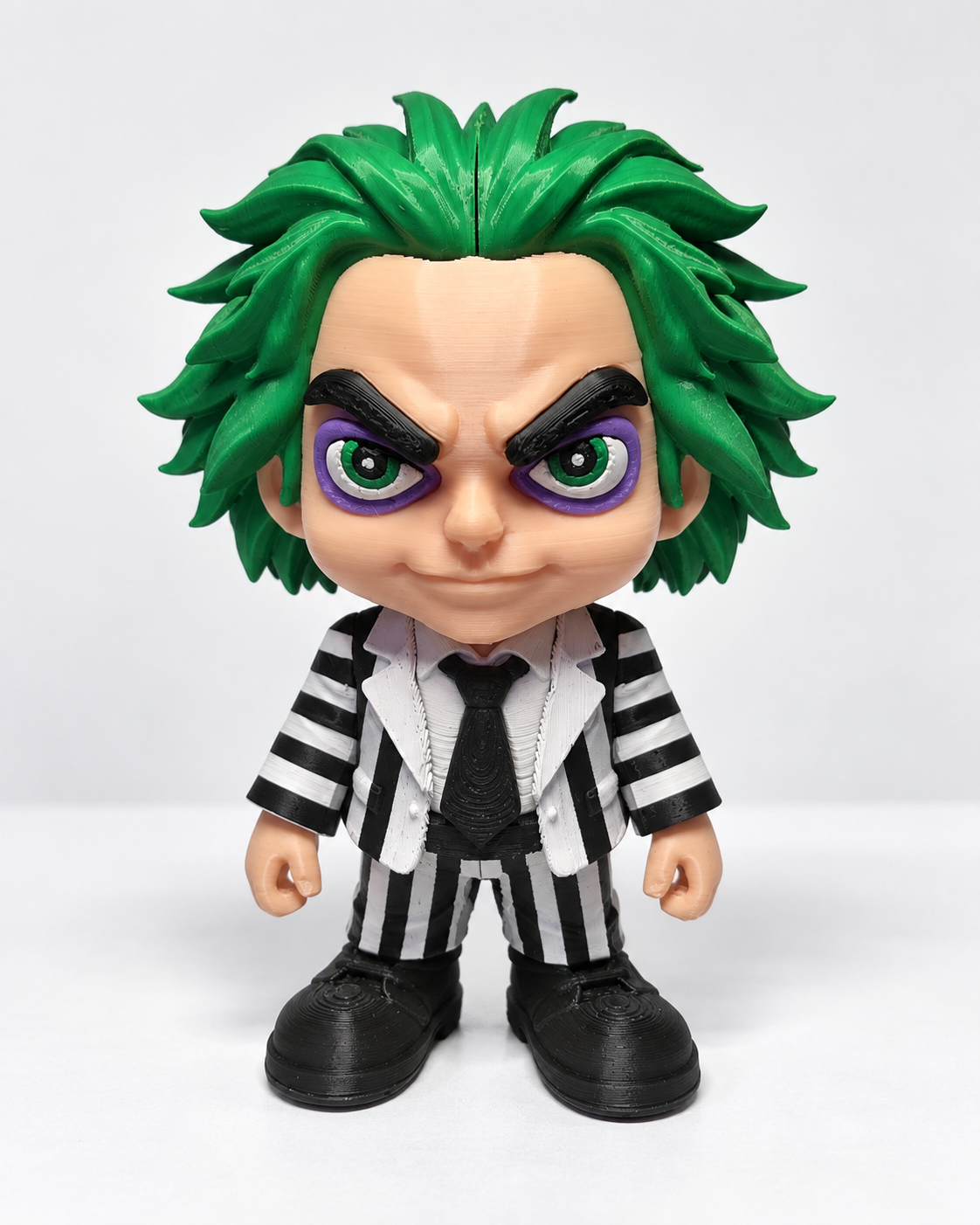 3D printed green-haired striped suit figure on a clean white background