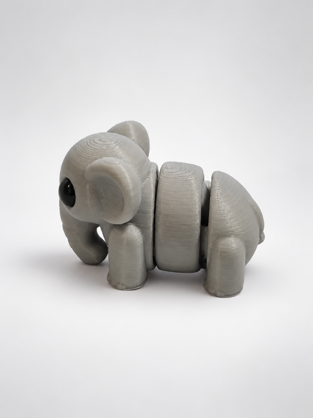 Grey articulated elephant from other side
