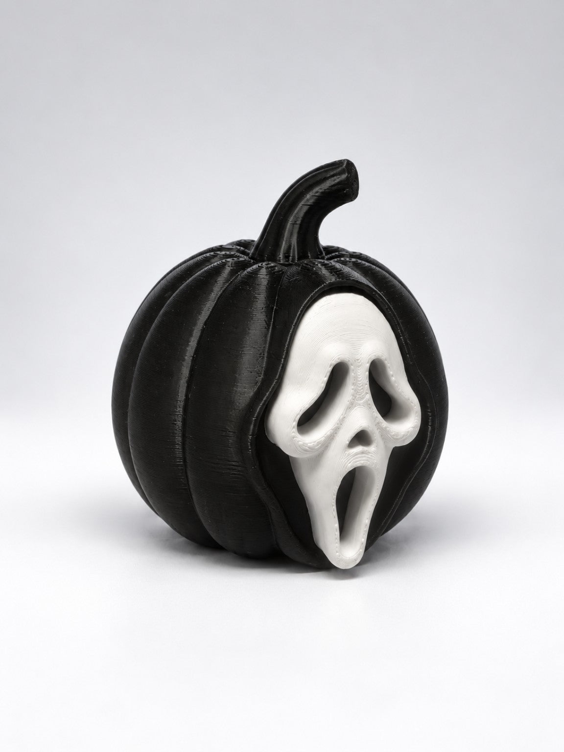 Black 3D printed screaming ghost pumpkin Halloween decoration right angled view